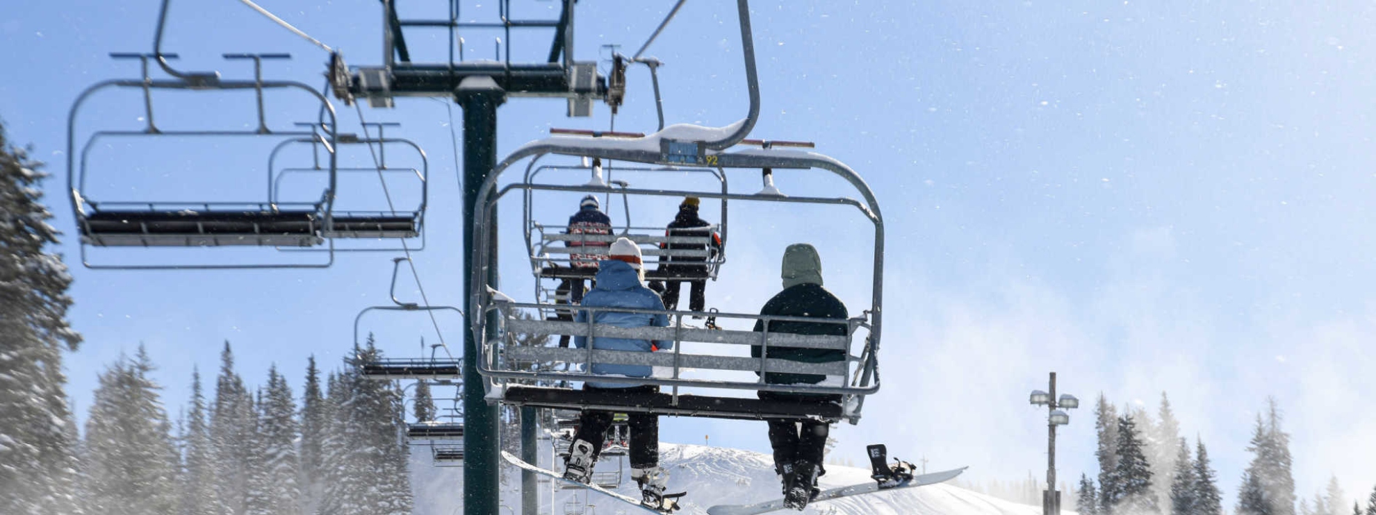 Friends on a lift together at Brighton Resort
