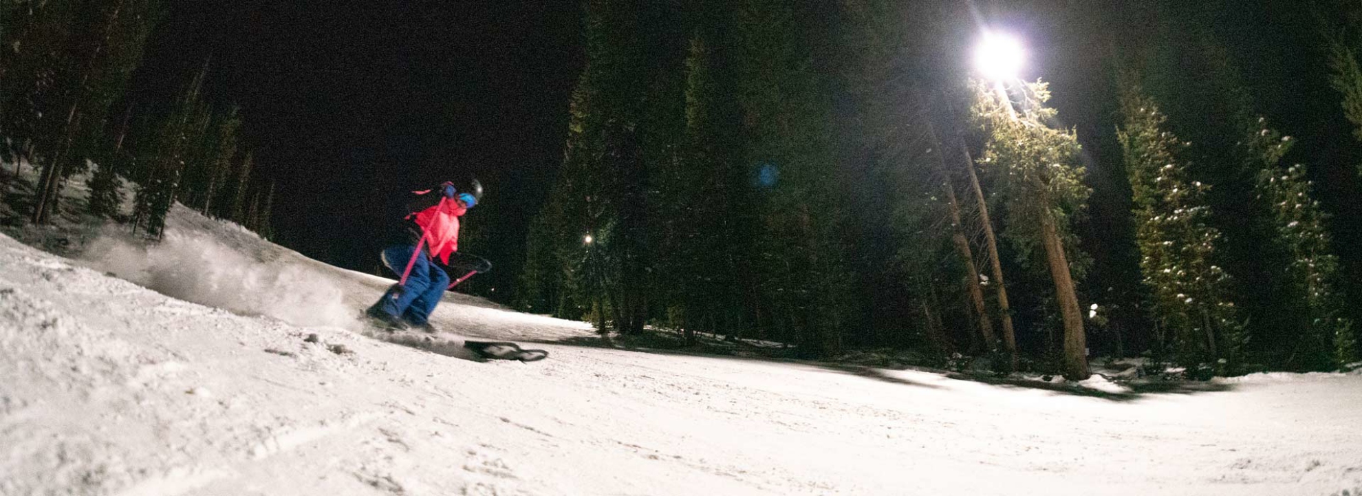 Skier riding at night at Brighton Resort, Utah